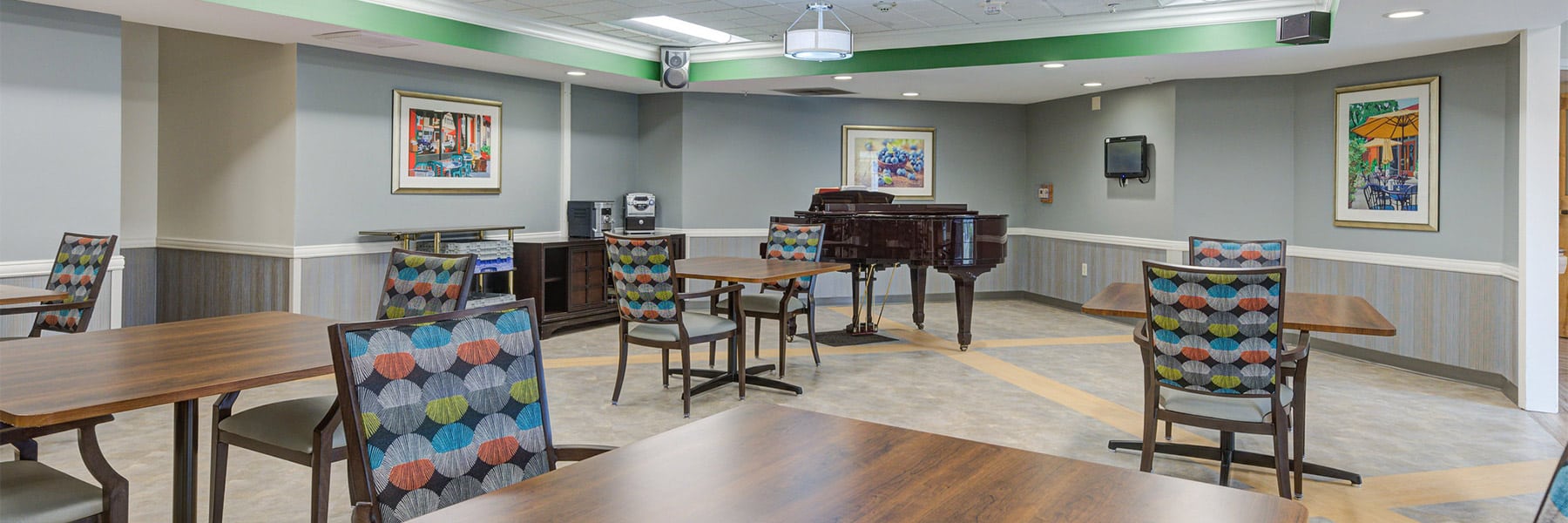 Seating and piano at Tice Valley Post Acute